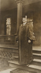 Photograph of President J. Campbell White Walking Down Stairs in a Robe by Unknown